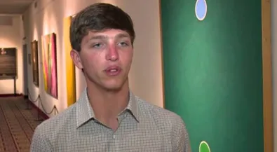 Guydoinginterviewinfrontofgreenwall_2023