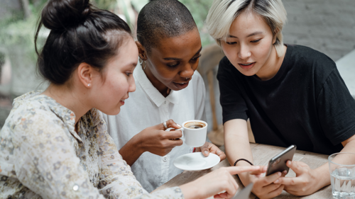 Girls chatting over a phone